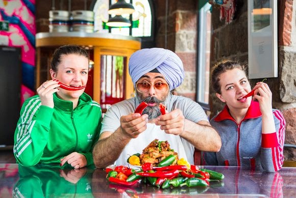 Sammy Bishop, Hardeep Singh Kohli and Weronika Celmer warm up for the Deep Heat Chilli Challenge. Credit: Paul Johnston at CopperMango