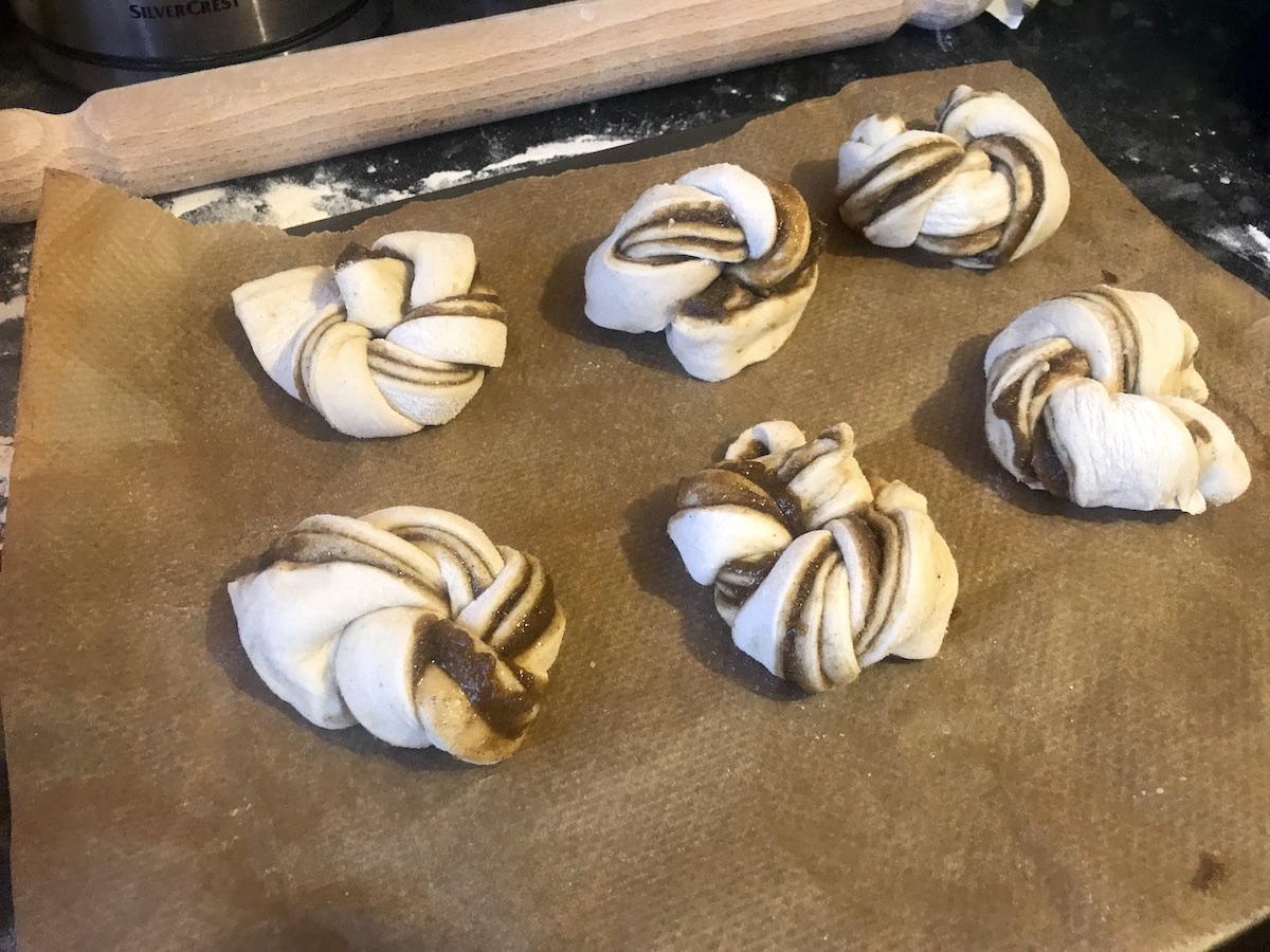 swedish style cardamom buns on baking tray