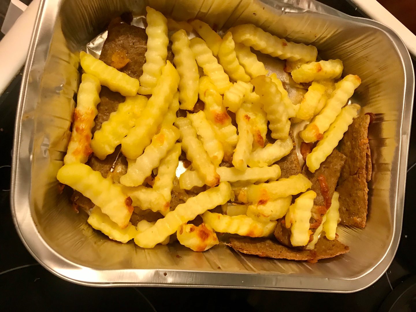 Kebab meat and cheesy chips after cooking 
