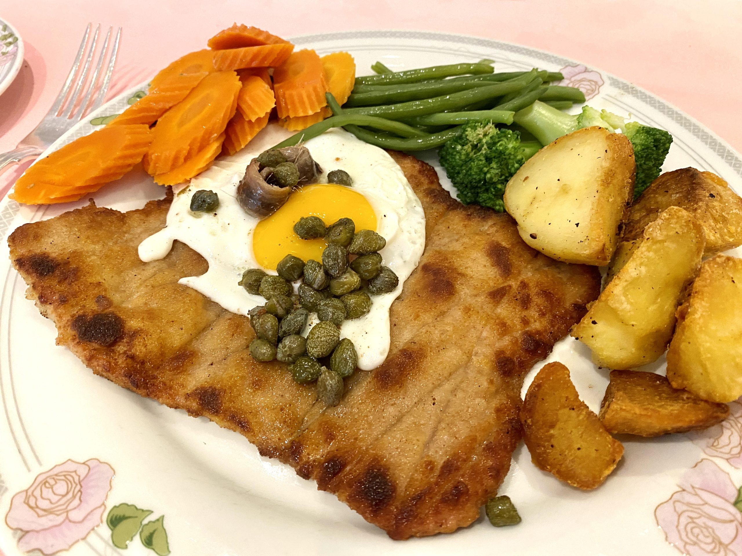 Veal schnitzel Holstein with fried egg anchovy and capers at Oslo Court