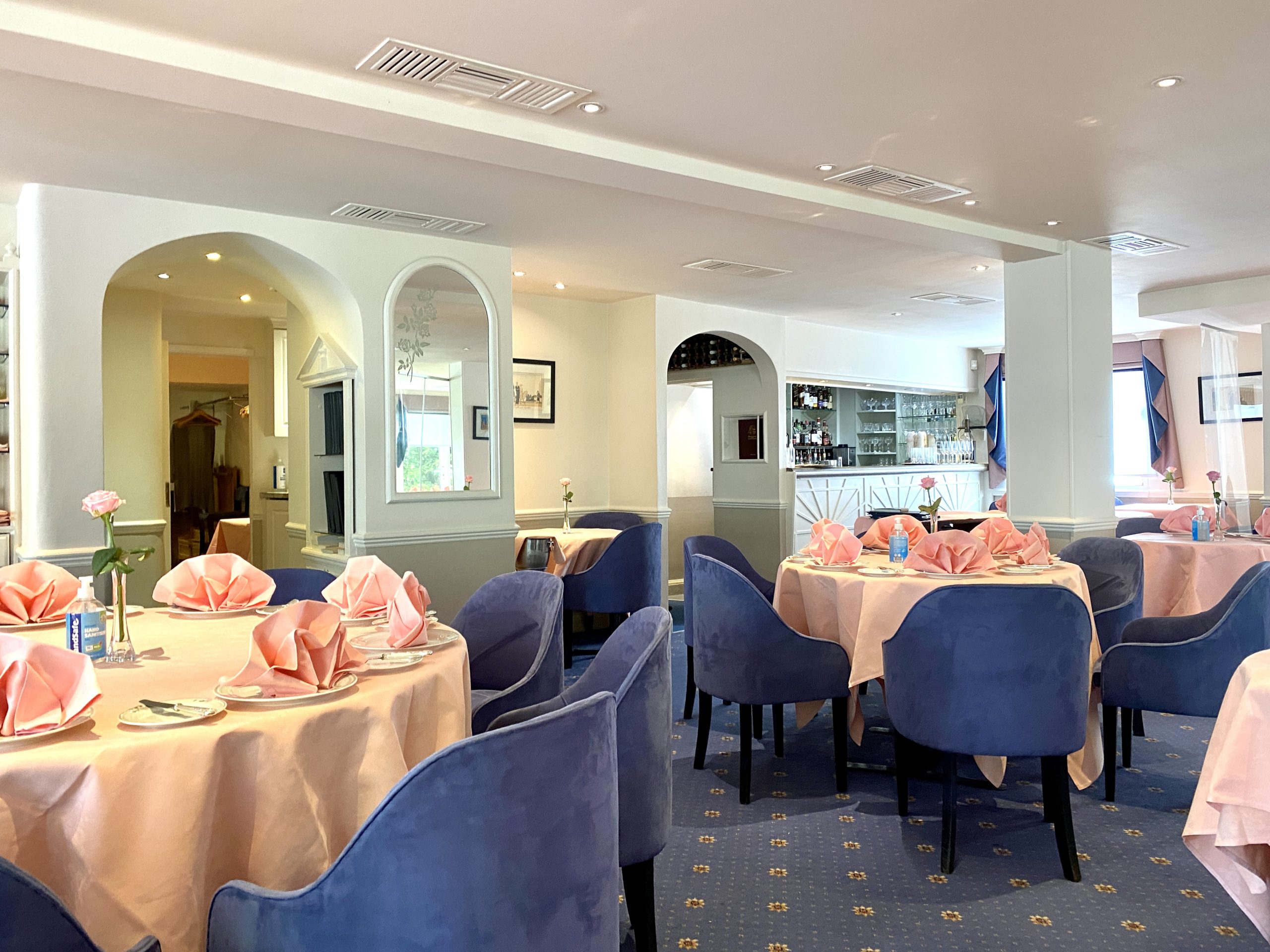 Interior of Oslo Court restaurant with pink napkins and retro dining room in London
