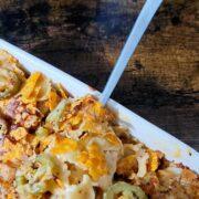 spicy mac and cheese recipe fork into mac and cheese dish