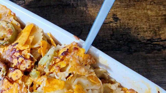 spicy mac and cheese recipe fork into mac and cheese dish