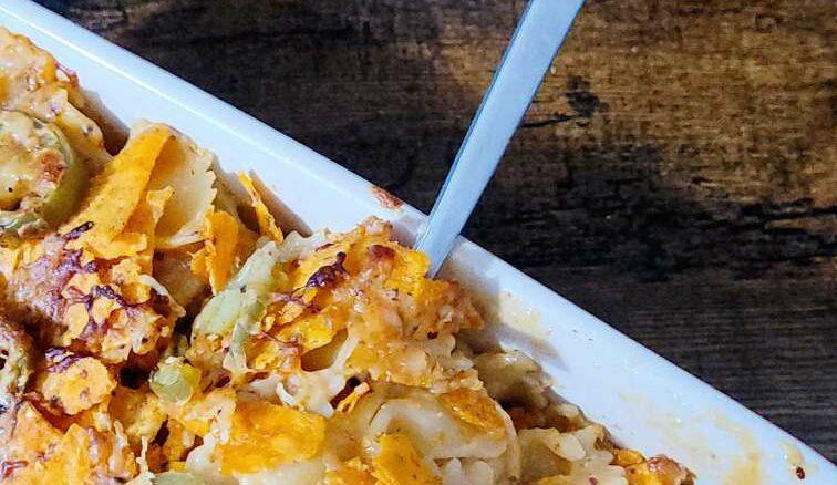 spicy mac and cheese recipe fork into mac and cheese dish