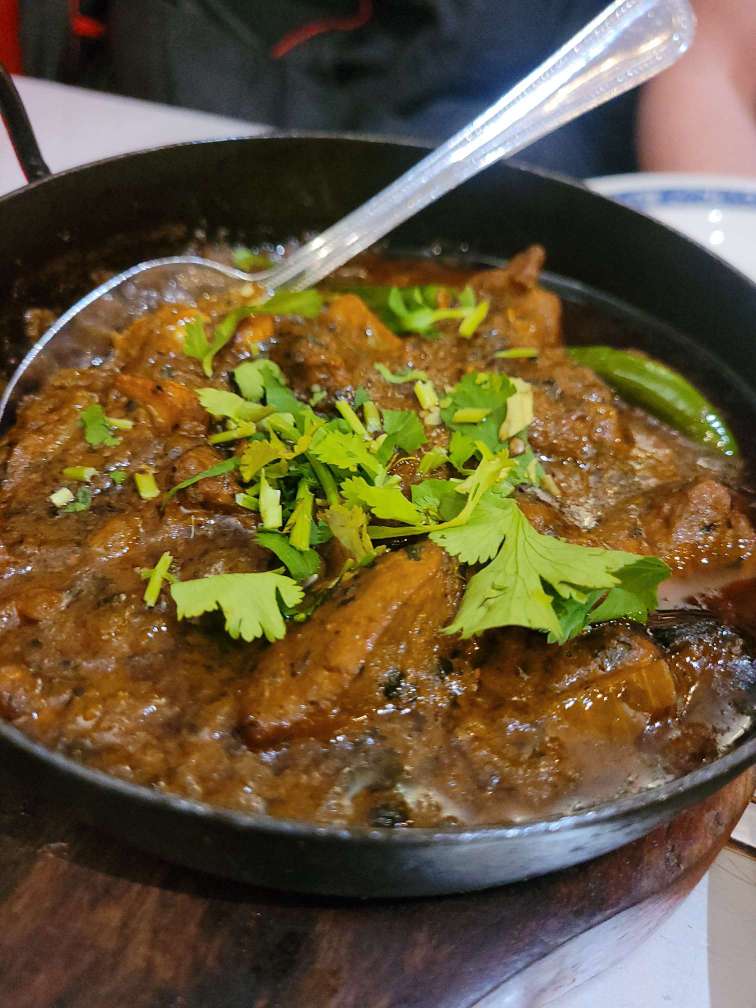 Rich curry served with fresh coriander at Prince of India Pitlochry