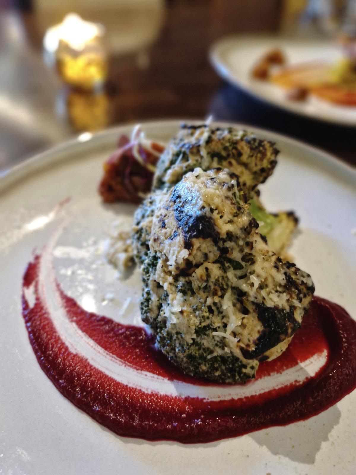 Tandoori Malai Broccoli - tandoor cooked broccoli with Parmesan, green cardamom and fig compote.
