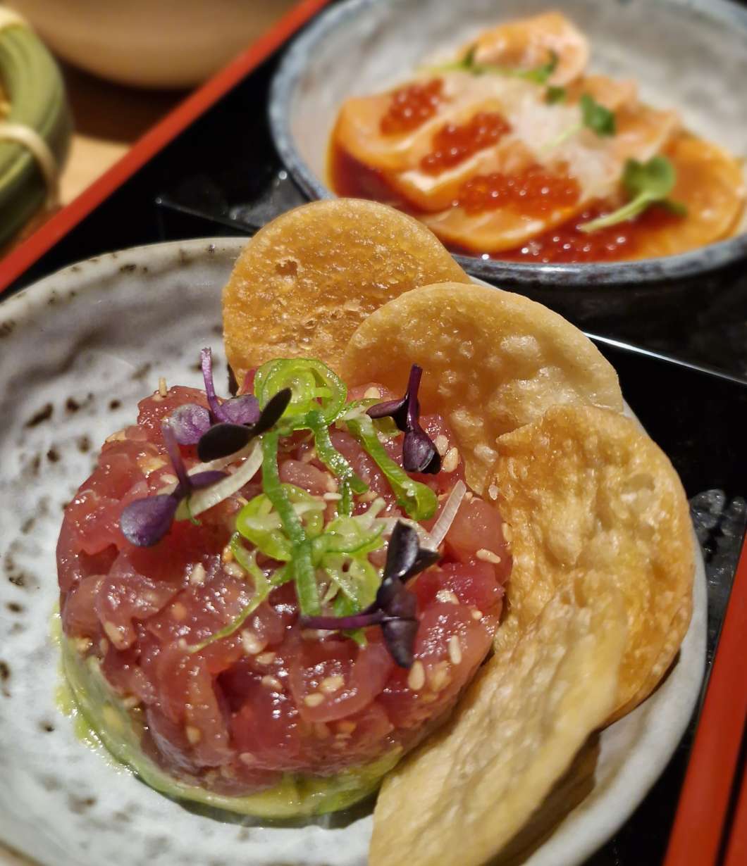 Tuna Tartare. Tuna, avocado, sesame, miso, yuzu and spring onion on crispy flat bread