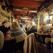 Interior of Il-Merill restaurant in Sliema Malta showing quirky vintage decor and cosy dining space
