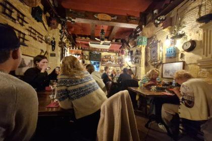 Interior of Il-Merill restaurant in Sliema Malta showing quirky vintage decor and cosy dining space