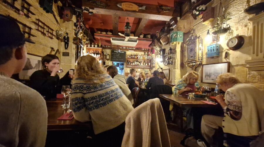 Interior of Il-Merill restaurant in Sliema Malta showing quirky vintage decor and cosy dining space