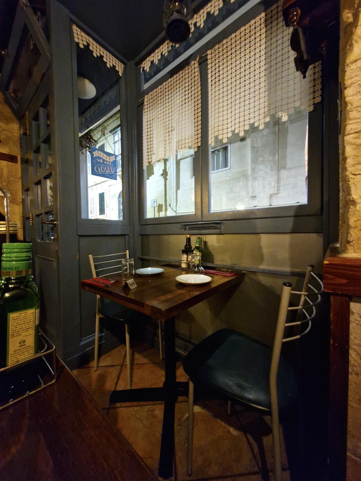 Table of traditional Maltese dishes at Il-Merill restaurant in Sliema Malta