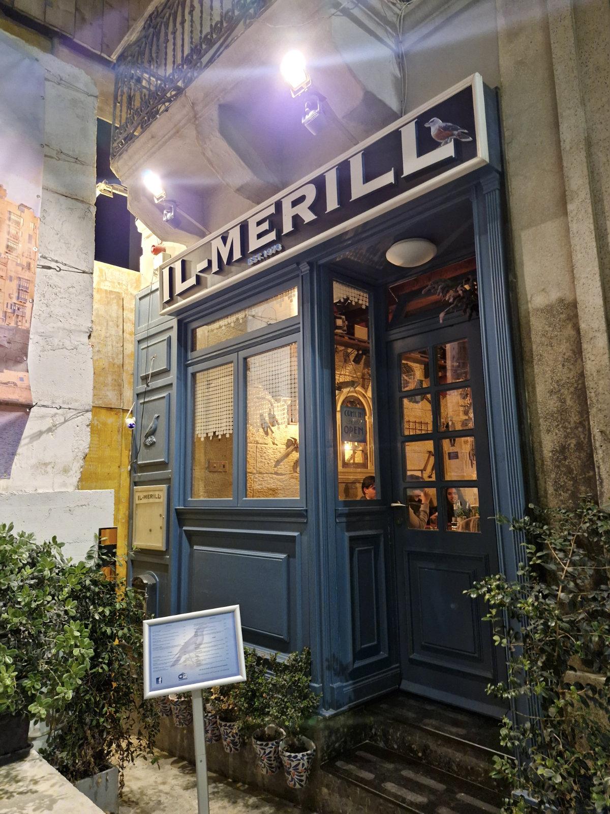 Exterior of Il-Merill restaurant on a quiet street in Sliema Malta