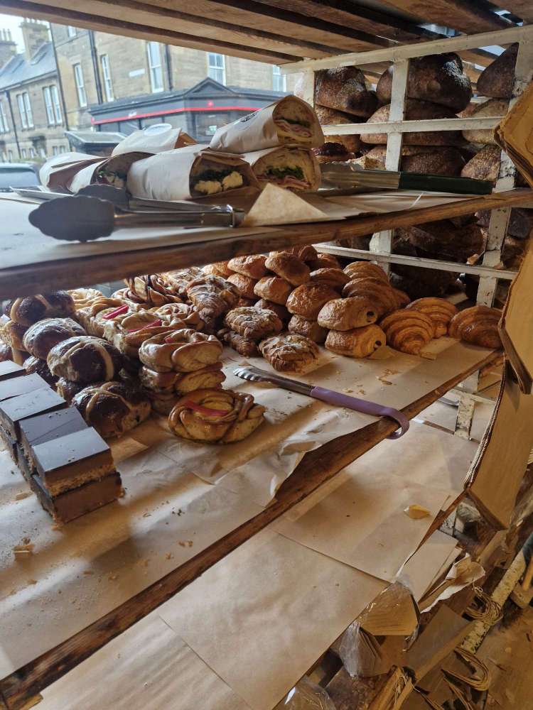 Twelve Triangles Stockbridge inside shelves filled with bread and pastries