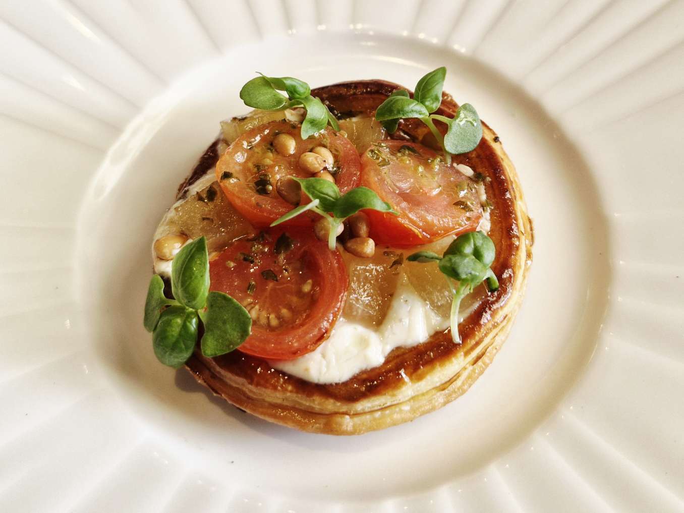 Beetroot and tomato tart with whipped cheese, confit tomato, basil and pine nuts