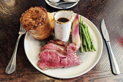 35-day-aged roast beef, accompanied by a Yorkshire pudding, beef-fat roast potatoes, cabbage, carrots, seasonal greens and red wine jus