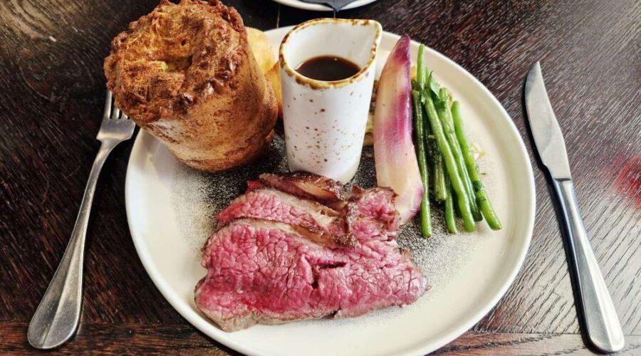 35-day-aged roast beef, accompanied by a Yorkshire pudding, beef-fat roast potatoes, cabbage, carrots, seasonal greens and red wine jus