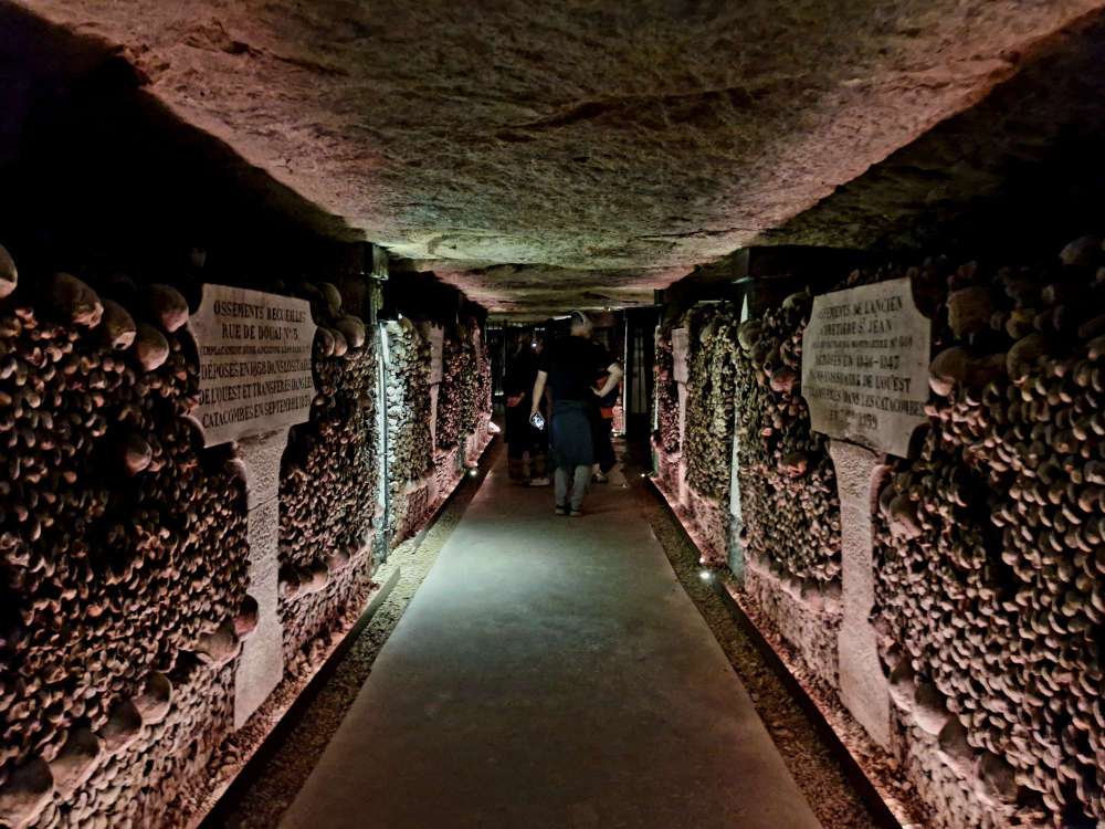 Underground ossuary walls in the Paris Catacombs