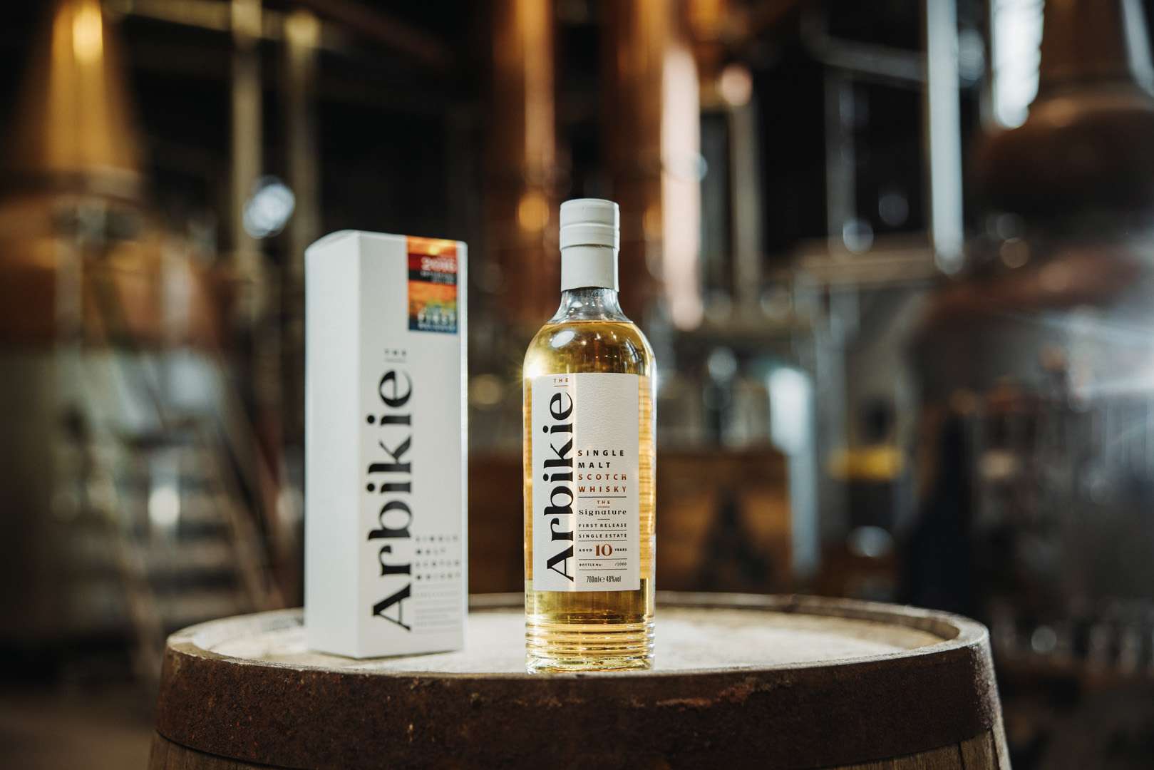 Arbikie launches The Signature – its first Single Estate Single Malt Scotch Whisky Arbikie Highland Estate Distillery in Angus has released The Signature, its first-ever Single Estate Single Malt Scotch Whisky and the opening release in the Scottish farm distillery’s new single malt programme. Launching on 7 September 2026, exactly ten years after Arbikie filled its first whisky cask, The Signature is a limited-edition 10-year-old Scotch whisky produced entirely on the family-owned Arbikie Estate in Angus. Only 1,000 bottles will be available worldwide, priced at £250 per bottle. Arbikie releases its first single malt Scotch whisky The launch is a major milestone for Arbikie Highland Estate Distillery, bringing together more than a decade of whisky production with around four centuries of farming by the Stirling family. Rather than sourcing ingredients from elsewhere, Arbikie's approach is centred around its field-to-bottle philosophy, with the barley grown, whisky distilled, matured and bottled on the same Angus estate. The Signature becomes the first expression in what will eventually become a wider Arbikie Single Estate Single Malt collection. A Scottish whisky grown, distilled and matured on one farm The Signature is produced using Odyssey barley grown on the Arbikie Estate, close to Scotland's east coast. Every stage in the production process has taken place on the farm, from growing the barley in the estate's coastal fields to distillation and maturation. The whisky spent ten years maturing in six bourbon casks, housed inside former dairy warehouses on the estate, before being bottled at 48% ABV. That makes The Signature a genuine expression of Arbikie's single-estate approach, with the climate, farmland, ingredients and production team all contributing to the finished whisky. What does Arbikie The Signature taste like? According to Arbikie, The Signature opens with aromas of: - ripe peach - banana bread - lemon sherbet On the palate, drinkers can expect flavours of brioche, apricot marmalade and citrus, followed by a finish featuring creamy vanilla, orange blossom and lingering spice. The bourbon cask maturation brings additional sweetness and vanilla character while allowing the barley and fruitier notes of the spirit to remain prominent. Ten years in the making The whisky has been a decade-long project for Arbikie's small distilling team. Iain Stirling, Co-Founder of Arbikie Highland Estate Distillery, said: «"The Signature represents everything our team has been working towards since we filled our first casks ten years ago.» «"It is our first Single Estate Single Malt Scotch Whisky, but more importantly it demonstrates what can be achieved when every decision, from the barley we grow to the casks we fill, happens on the same estate."» The distillery deliberately avoided rushing its first single malt onto the market simply to meet demand. Stirling added that the team wanted the first whisky to represent Arbikie's farm, family and approach to whisky making, describing the release as the result of ten years of patience and work. Arbikie's field-to-bottle whisky approach Situated on the Angus coast, Arbikie Highland Estate Distillery has built its reputation around producing spirits using crops grown on its own farm. The independently owned Scottish distillery has increasingly focused on traceability, provenance and sustainable production, giving it a distinctive position among Scotland's growing generation of farm distilleries. Arbikie is also a certified B Corp and was named Sustainable Distillery of the Year at the Icons of Whisky 2026. The arrival of its first single malt represents another important stage in the development of the distillery. More Arbikie single malt whiskies are coming The Signature is not intended to be a one-off whisky. Instead, it marks the beginning of Arbikie's long-term Single Estate Single Malt Scotch Whisky programme. Future limited releases are expected to examine how Arbikie whisky develops through different ages, cask types and maturation techniques while continuing to follow the distillery's field-to-bottle philosophy. Further details about upcoming Arbikie whisky releases will be announced in the future. How much is Arbikie The Signature? Arbikie The Signature costs £250 for a bottle. The limited-edition whisky has been bottled at 48% ABV, with just 1,000 bottles available worldwide. Given the small production run and its status as Arbikie's first single malt Scotch whisky, it is likely to be of particular interest to whisky collectors and drinkers looking for unusual Scottish single malts. Where can you buy Arbikie The Signature? Arbikie The Signature Single Estate Single Malt Scotch Whisky launches on 7 September 2026. It will be available directly from the Arbikie Highland Estate Distillery website as well as through selected Arbikie trade partners around the world. Arbikie The Signature at a glance Whisky: Arbikie The Signature Distillery: Arbikie Highland Estate Distillery Location: Angus, Scotland Type: Single Estate Single Malt Scotch Whisky Age: 10 years Barley: Odyssey barley grown on the Arbikie Estate Casks: Six bourbon casks ABV: 48% Number of bottles: 1,000 worldwide Price: £250 Release date: 7 September 2026 The Signature is an important moment not only for Arbikie but for Scotland's growing farm-distillery movement. With everything from the barley to the finished bottle rooted in one Angus estate, this first single malt offers whisky fans a chance to taste the beginning of what could become a particularly interesting new chapter in Scottish whisky.